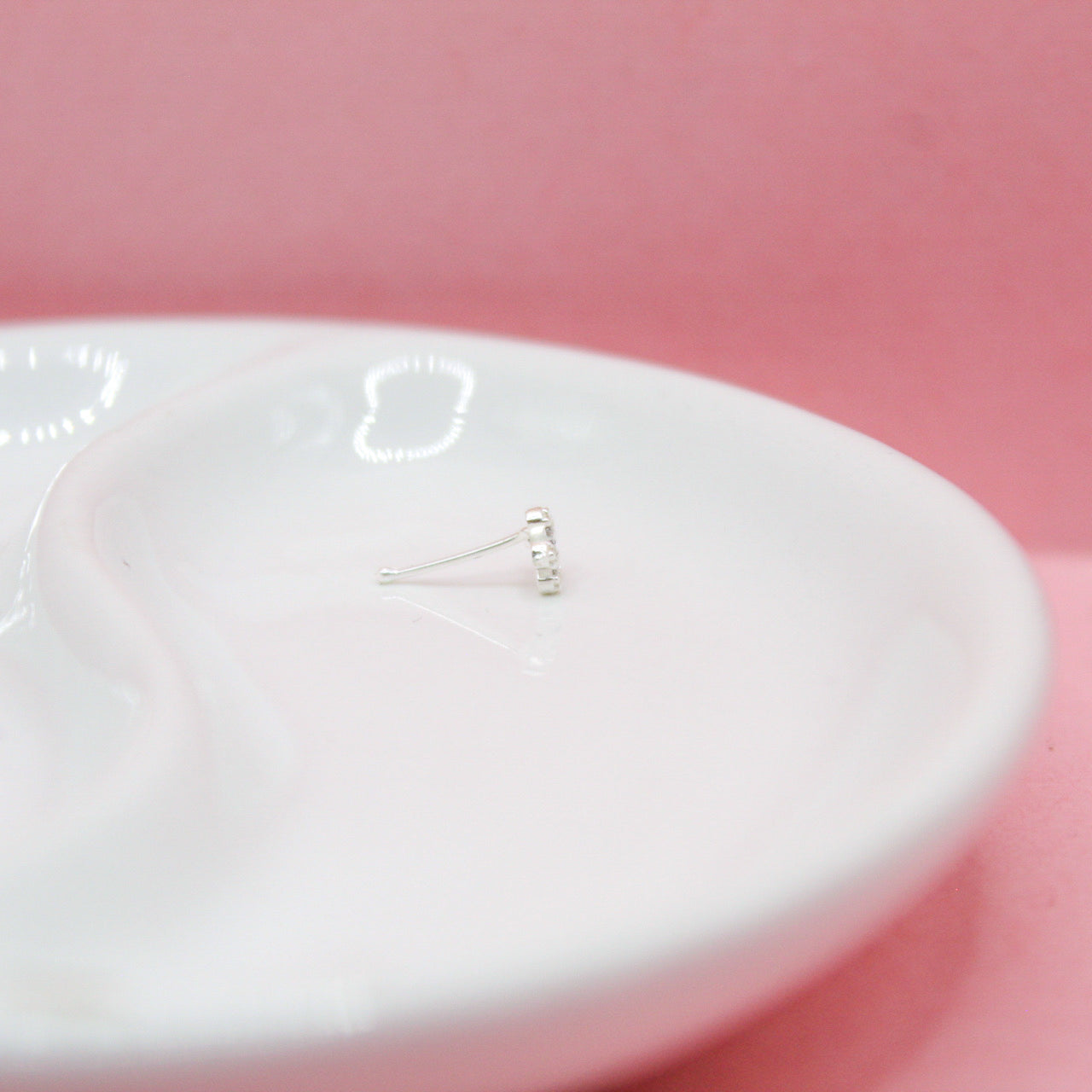 NOSTRIL FLOR CENTRO ZIRCONIA AZUL .925