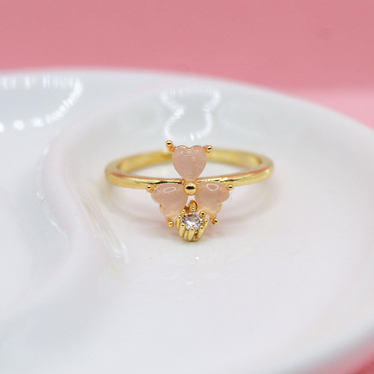 ANILLO TRES CORAZONES ROSAS CON ZIRCONIA COLGANTE