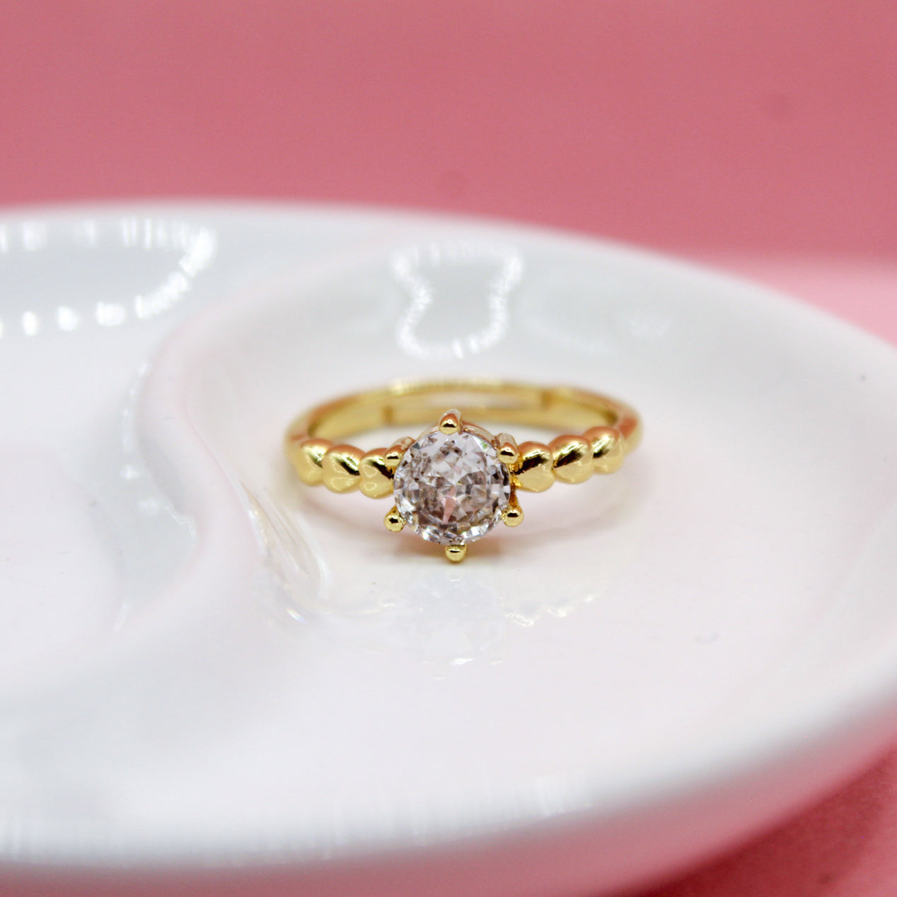 ANILLO ZIRCONIA REDONDA TRES CORAZONES LISOS