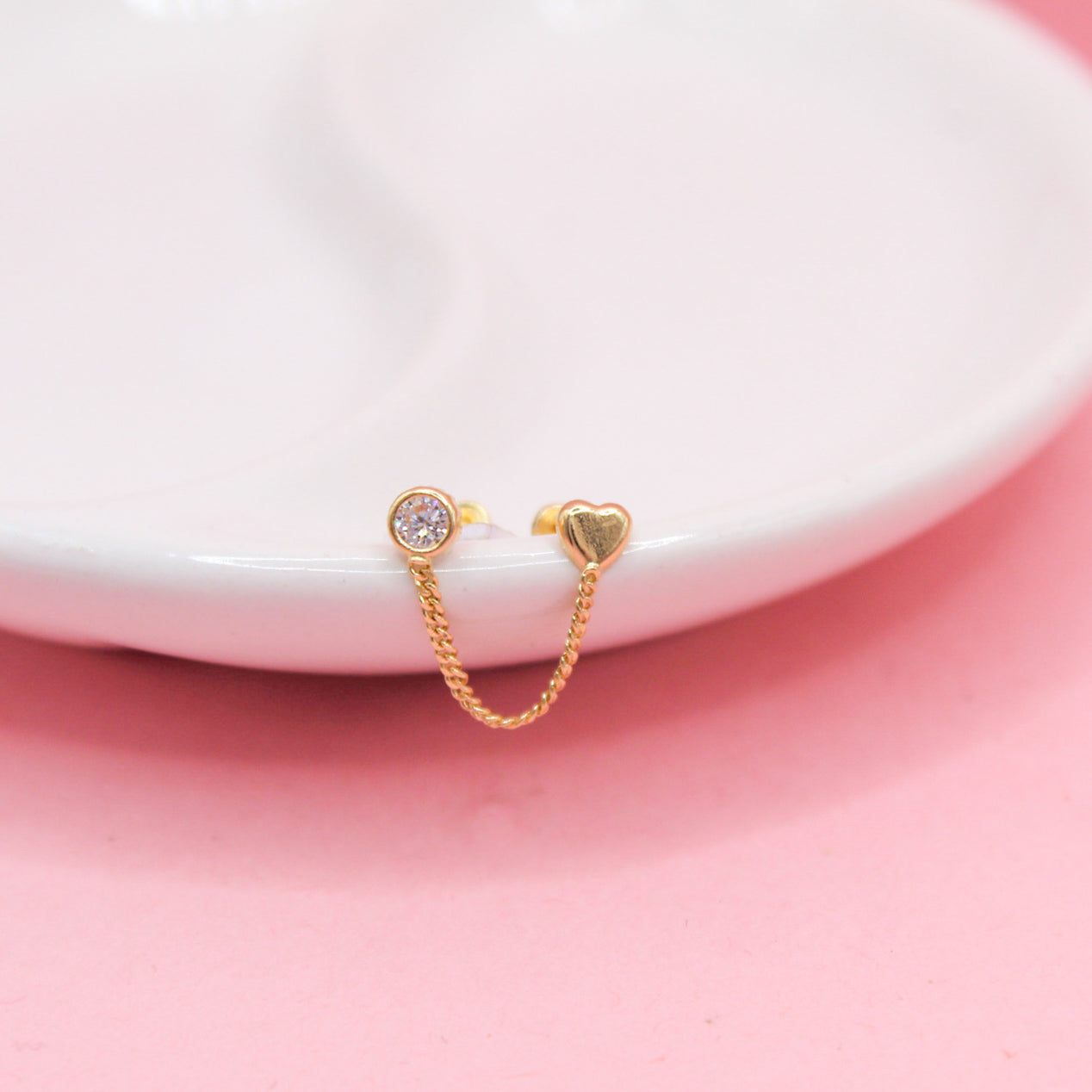 ZIRCONIA BICELADA Y CORAZÓN LISO CON CADENA 10K