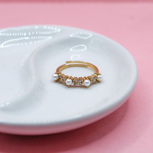 ANILLO CUATRO PERLAS Y TRES FLORES ZIRCONIAS