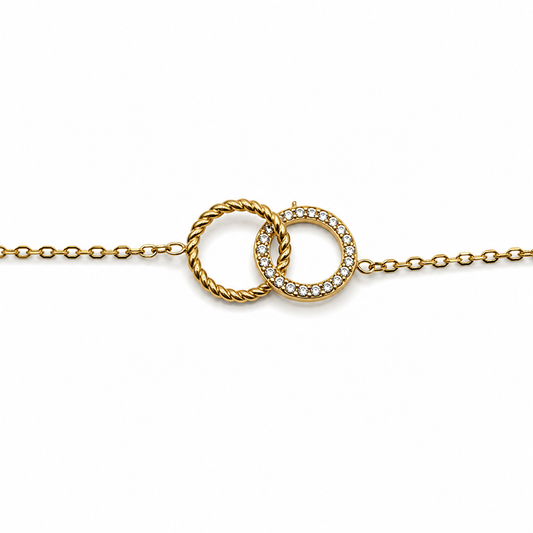 PULSERA DOS CÍRCULOS ZIRCONIAS Y TORCIDO ENTRELAZADOS