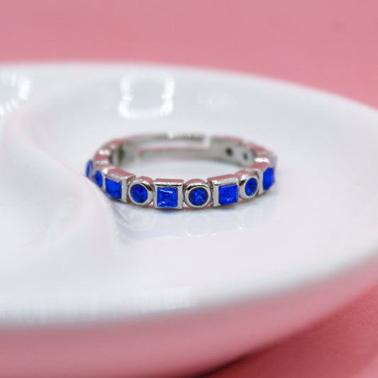 ANILLO PLATEADO ZIRCONIAS AZULES