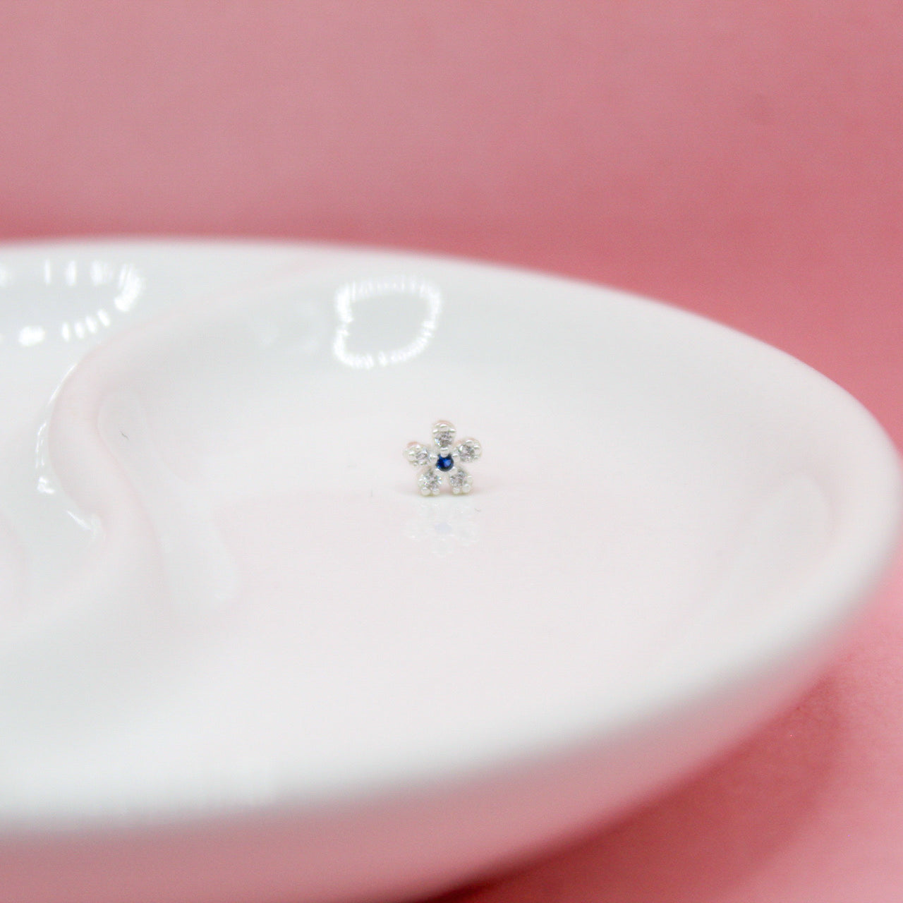 NOSTRIL FLOR CENTRO ZIRCONIA AZUL .925