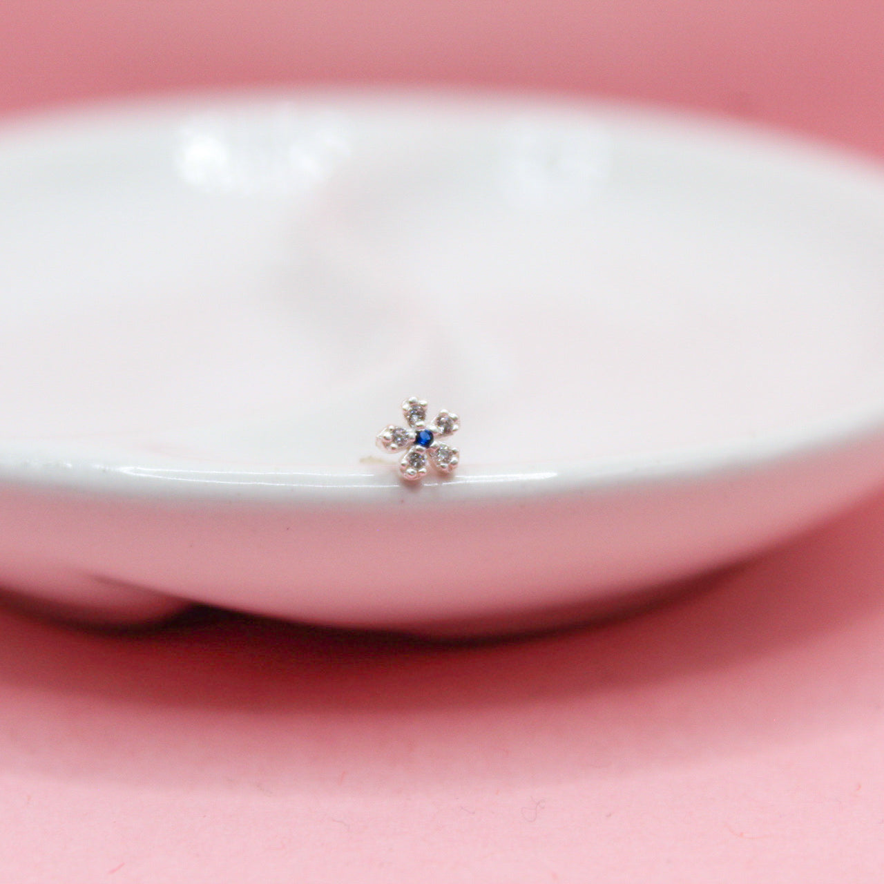 NOSTRIL FLOR CENTRO ZIRCONIA AZUL .925