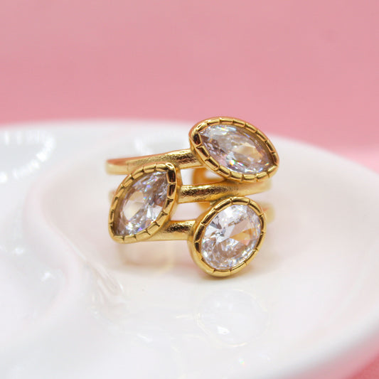 ANILLO TRES BANDAS CON ZIRCONIAS OVALADAS BLANCAS