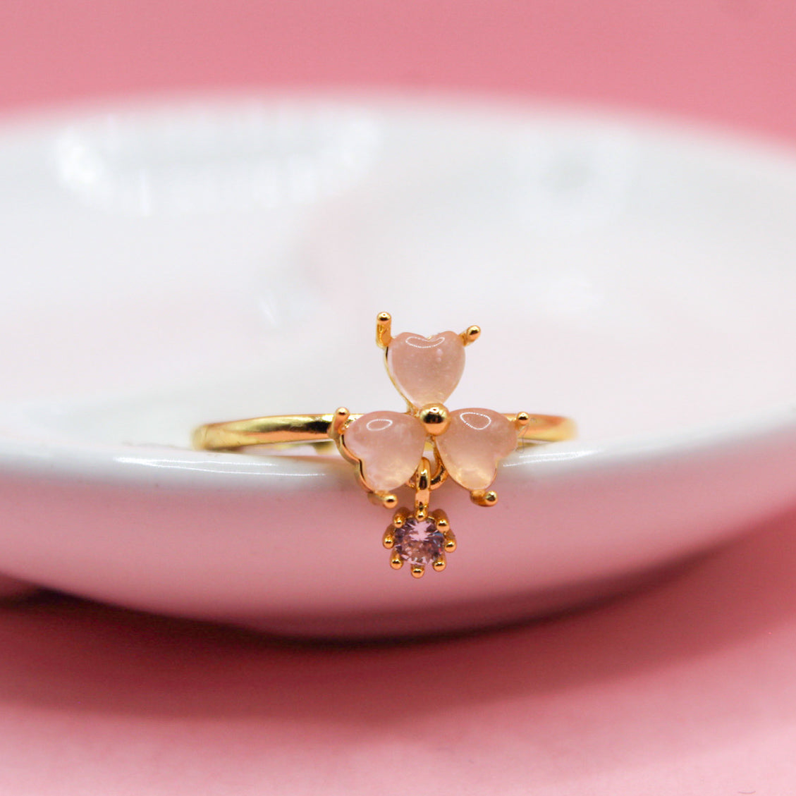 ANILLO TRES CORAZONES ROSAS CON ZIRCONIA COLGANTE